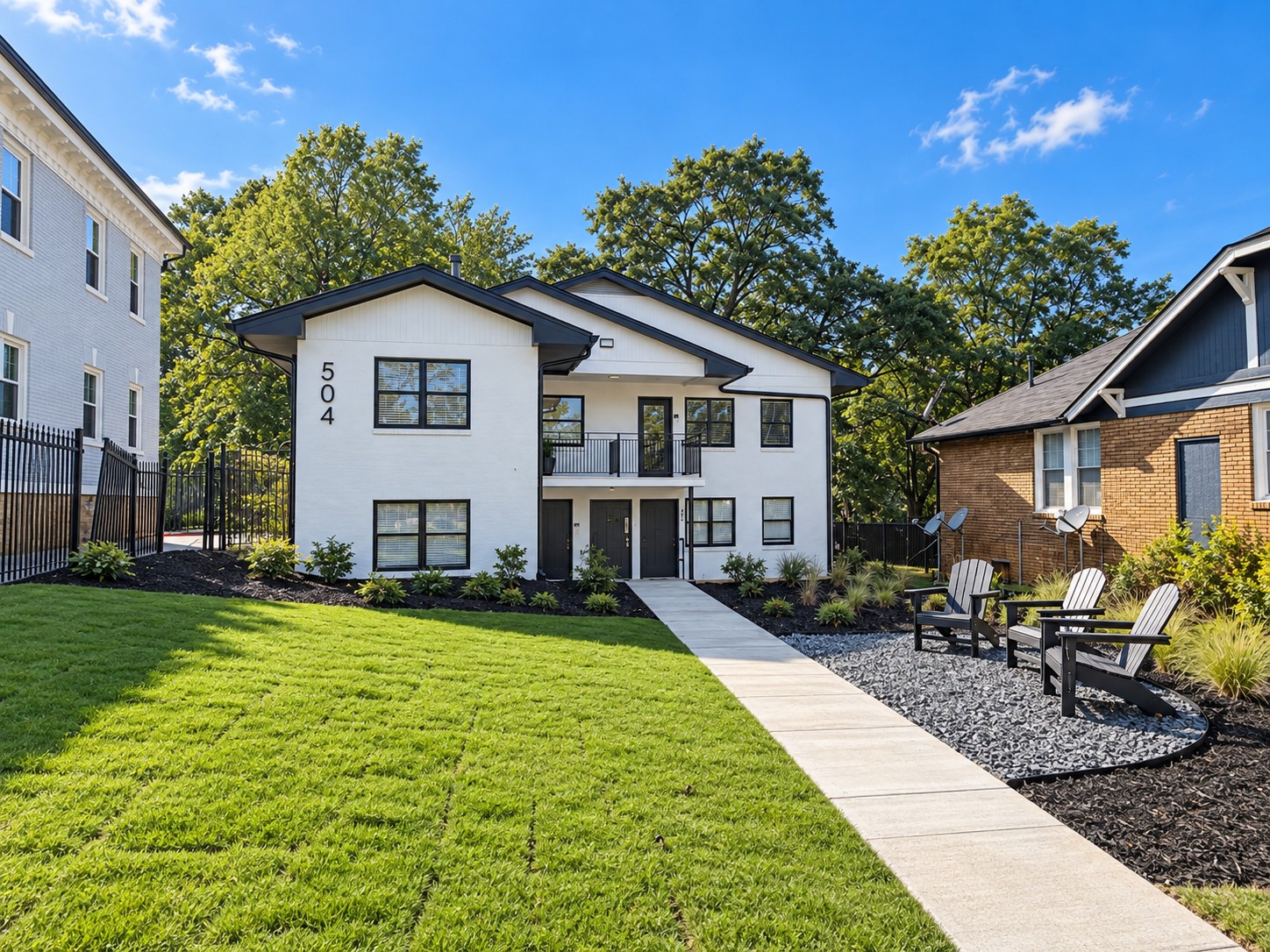 Exterior lawn and Adirondack chairs at 504 Parkway