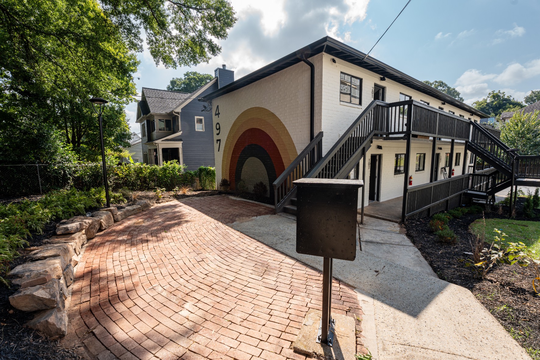 Patio and apartment building exterior at 497 Boulevard Place