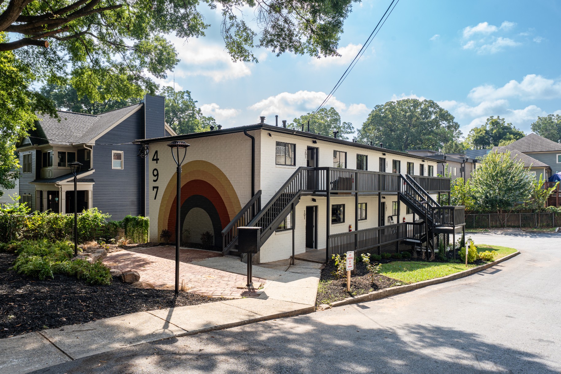Street view of 497 apartments with exterior patio area